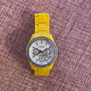 Yellow fossil watch with diamonds